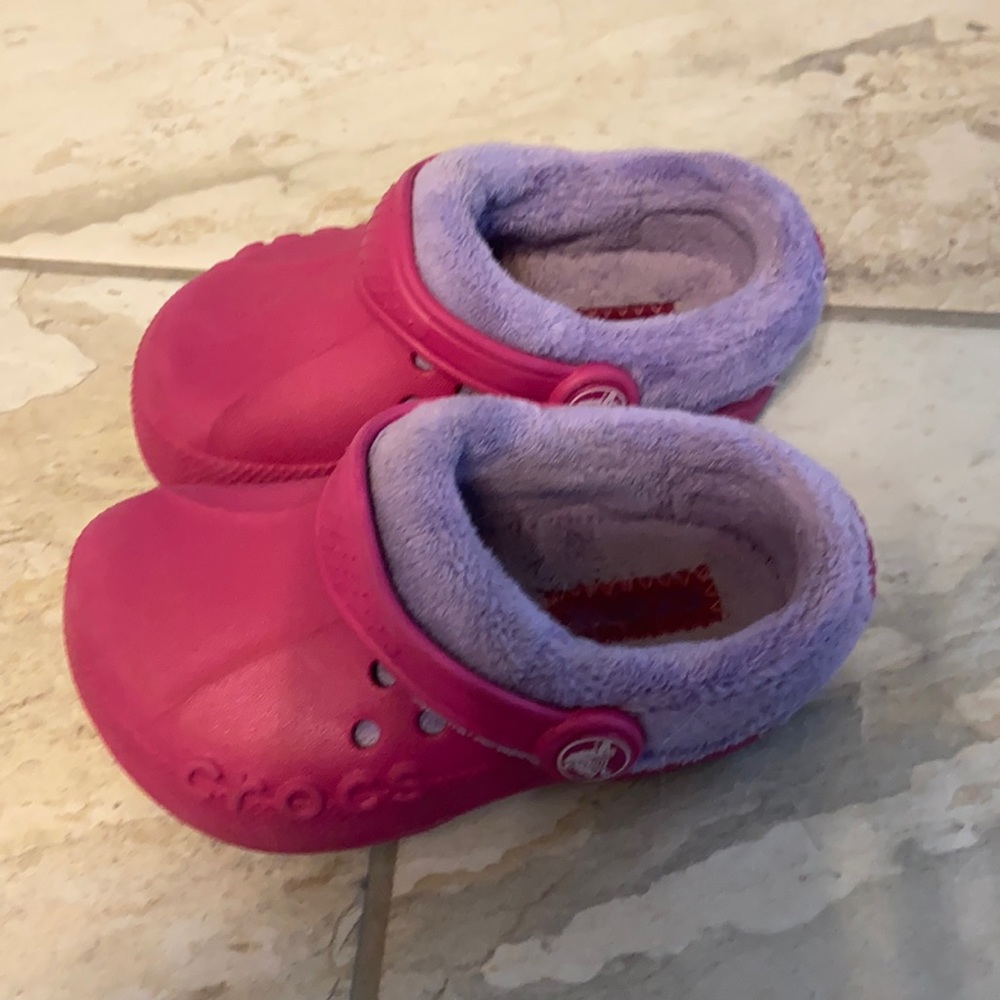 Pink Crocs in size 8/9 with purple fuzzy lining